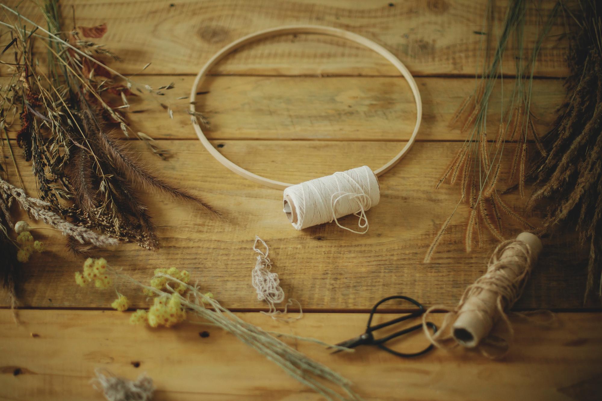 studio table with hoops and threads